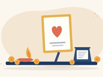 Illustration of a lit diya, a framed tribute card with a heart, marigold flowers and a small note card on a table, for donating in memory of a loved one