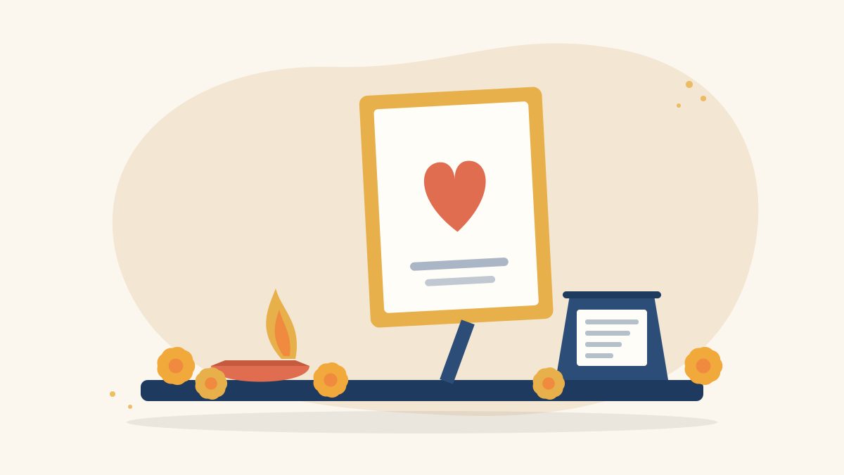 Illustration of a lit diya, a framed tribute card with a heart, marigold flowers and a small note card on a table, for donating in memory of a loved one