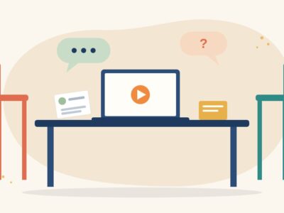 Illustration of an interview table with two chairs, a laptop showing a video portfolio, a CV card, a note card and speech bubbles, for media job interview questions